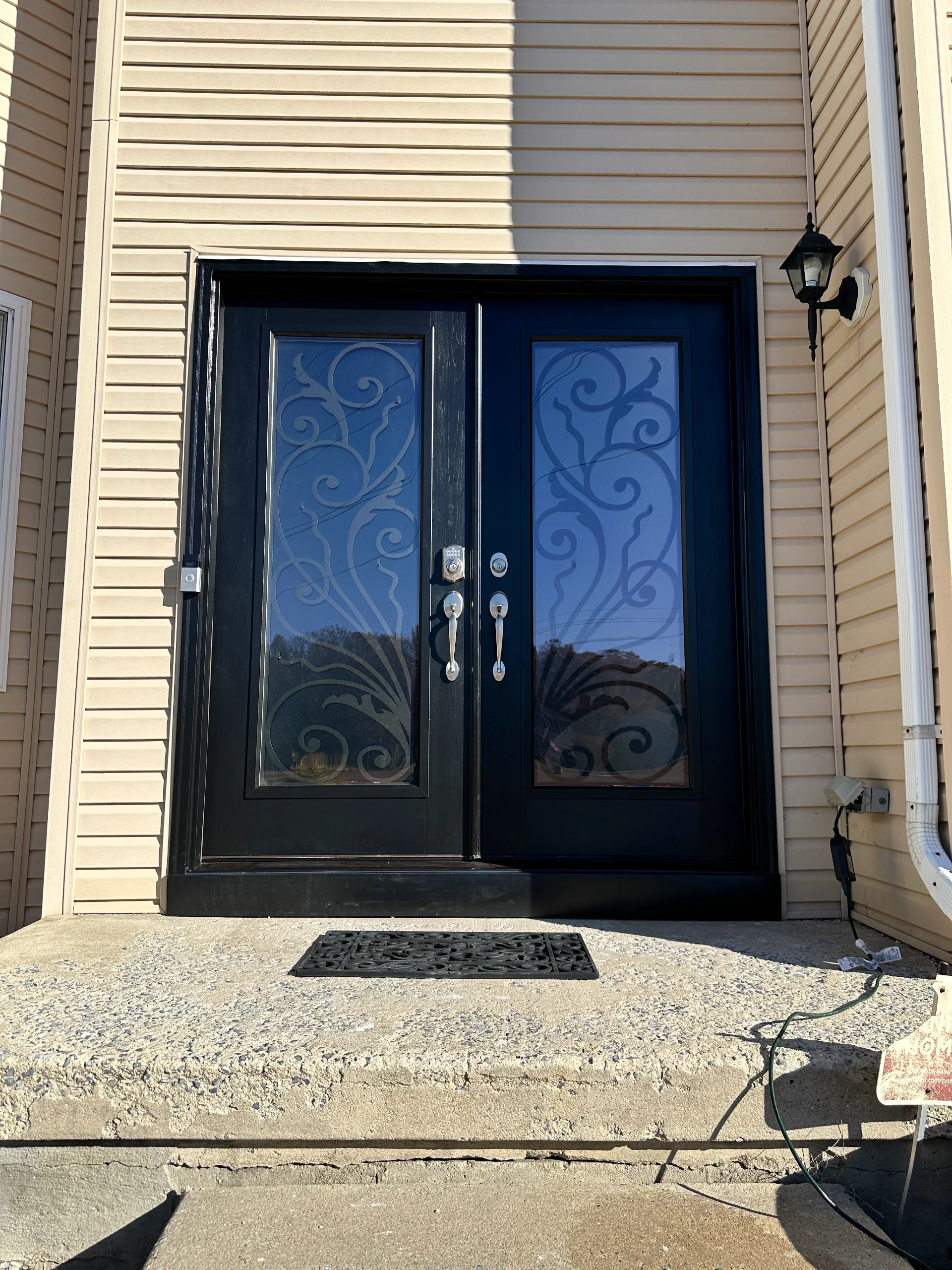 double-black-doors-simple-elegant-iron